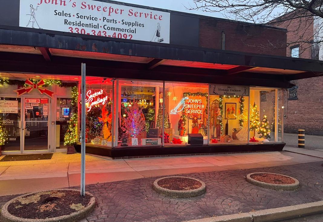 a store front with christmas lights