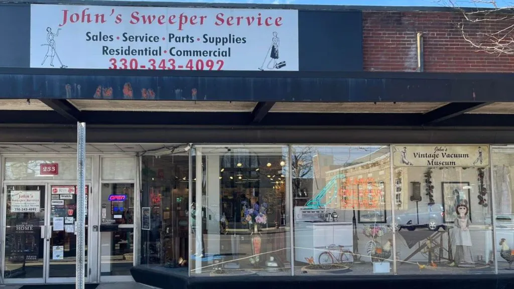 johns sweeper service outside building