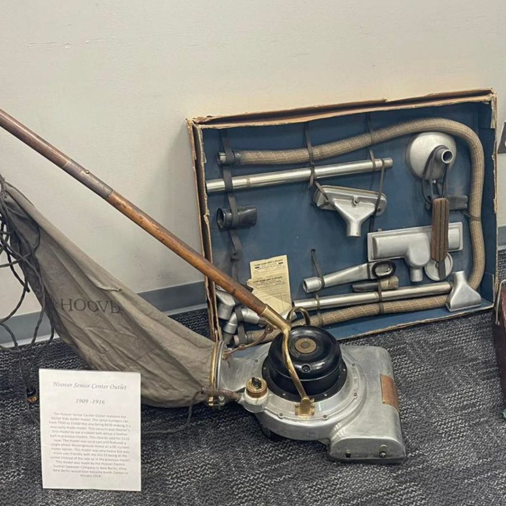 a vacuum cleaner and parts in a box