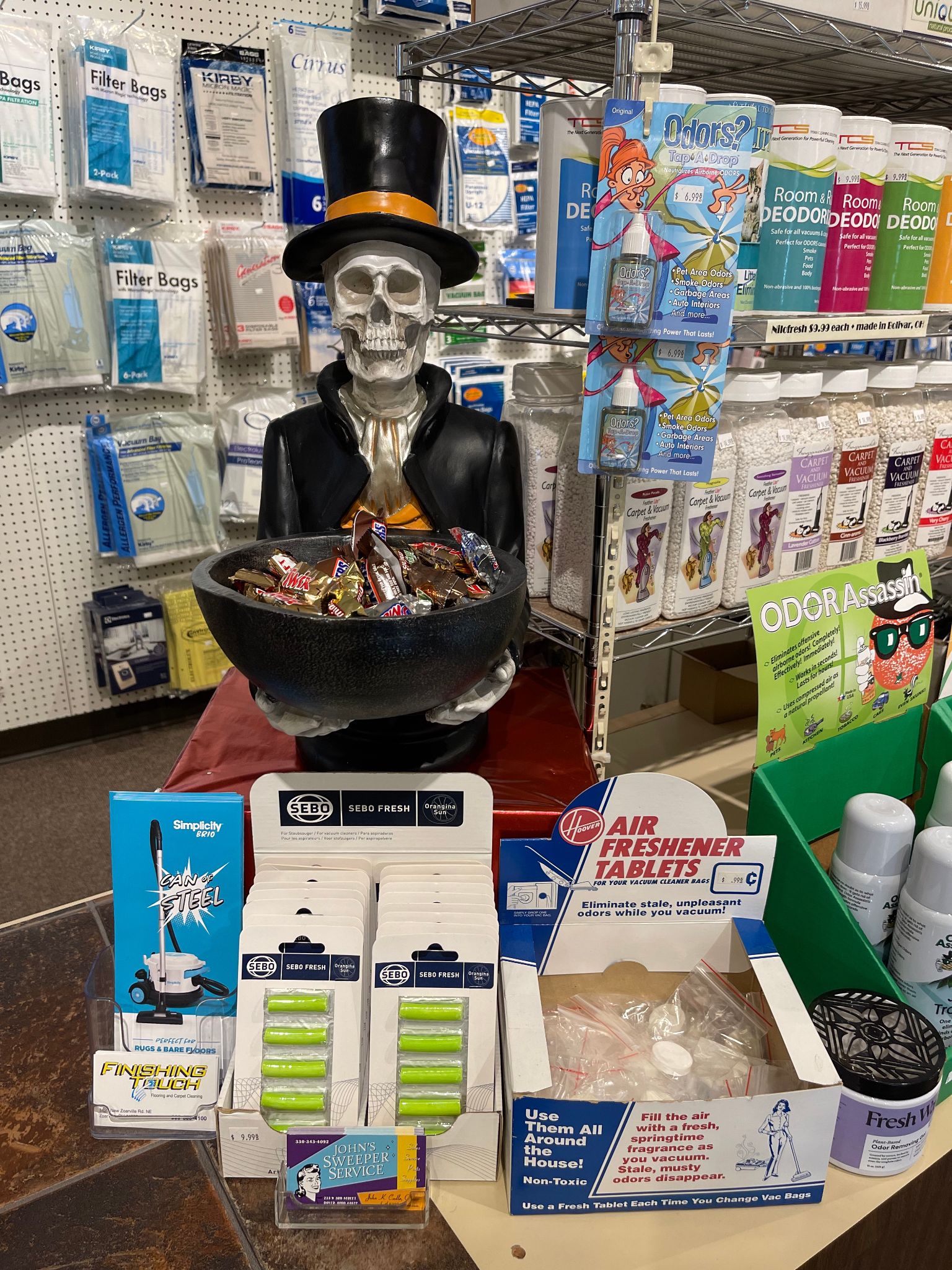 skeleton holding a bowl of candy