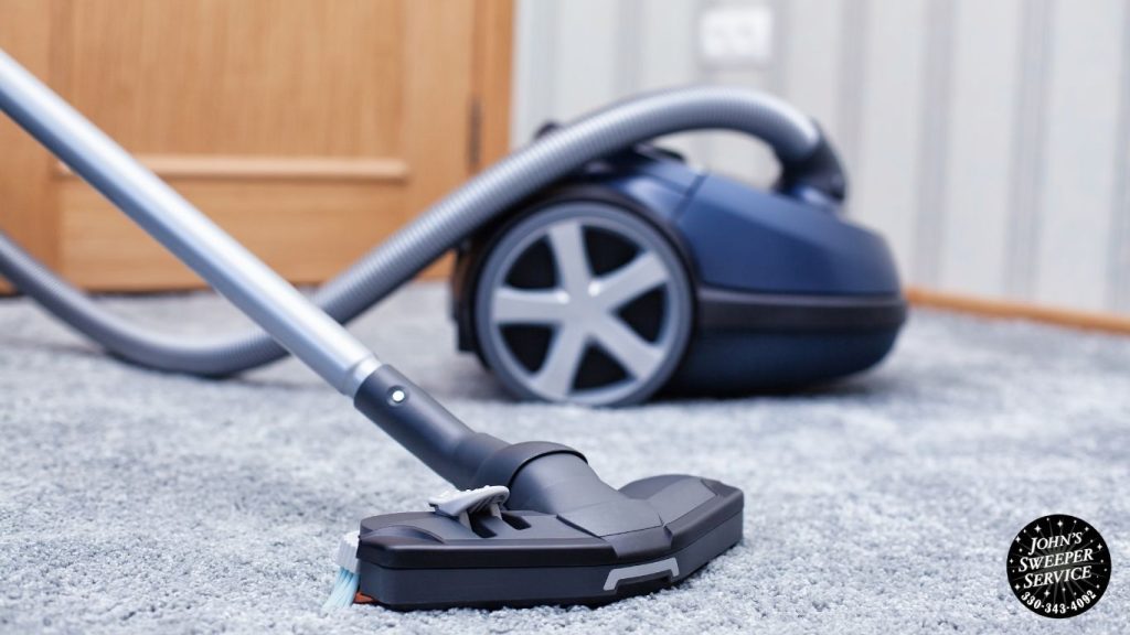 a vacuum cleaner on the floor next to a carpet